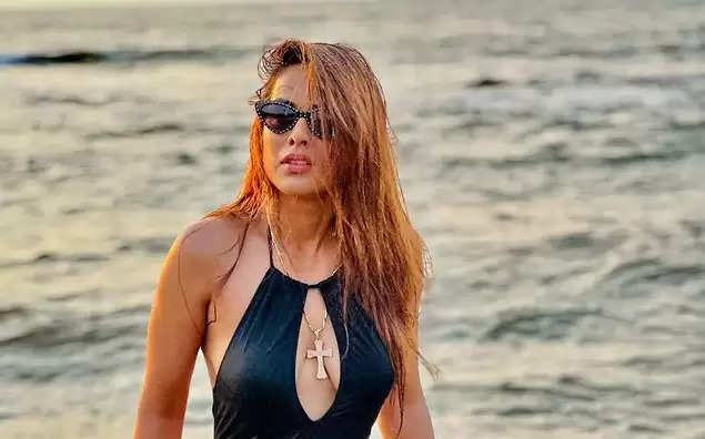 Photos: Nia Sharma Is A Sight To Behold In Racy Black Cutout Swimsuit, Check Out Diva's Stunning Swimwear Moments