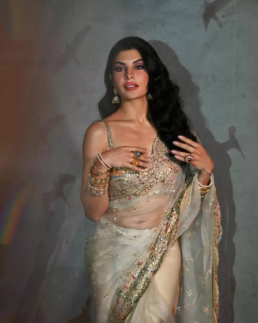 Jacqueline Fernandez looks pretty as she wears plum-coloured saree.  Jacqueline Fernandez is a sight to behold in matching embellished blouse.  Jacqueline Fernandez looks drop dead gorgeous in semi-sheer scalloped saree.  Jacqueline Fernandez opts for a sleeveless ornate blouse.  Jacqueline Fernandez makes jaw drop in floral-printed neon green saree.  Jacqueline Fernandez pairs the saree with a complimentary blouse.  Jacqueline Fernandez oozes oomph as she poses in off-white embellished saree.  Jacqueline Fernandez pairs the saree with a matching blouse.  Jacqueline Fernandez looks stunning in a tradtional golden saree.  Jacqueline Fernandez pairs the bright blue blouse with the saree.